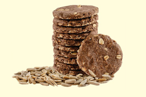 A-close-up-of-Ragi-and-Oats-cookies-layered-and-garnished-with-sunflower-seeds-emphasizing-a-wholesome-treat
