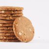 A-neatly-arranged-stack-of-honey-oat-cookies-against-a-white-background-highlighting-their-inviting-appearance