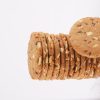 A-neatly-arranged-stack-of-multigrain-cookies-set-against-a-white-background-highlighting-their-wholesome-appearance