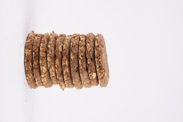 A-neatly-arranged-stack-of-ragi-sugar-free-cookies-on-a-white-background-highlighting-their-wholesome-appearance