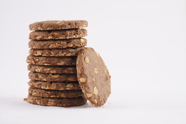A-neatly-arranged-stack-of-ragi-sugar-free-oats-cookies-against-a-plain-white-background