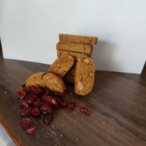 Cranberry Biscotti 1 A-pile-of-cranberry-biscotti-cookies-and-fresh-cranberries-arranged-on-a-wooden-table