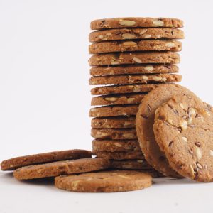 A-stack-of-multigrain-cookies-on-a-clean-white-background-showcasing-their-texture-and-color