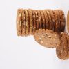 A-visually-appealing-stack-of-multigrain-cookies-displayed-on-a-white-background-emphasizing-their-rustic-texture