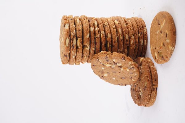 A-visually-appealing-stack-of-multigrain-cookies-displayed-on-a-white-background-emphasizing-their-rustic-texture