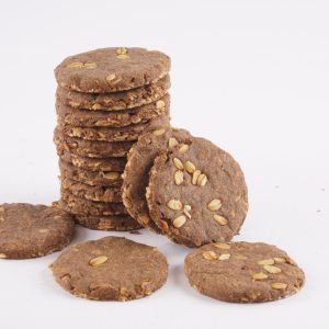 A-white-background-features-a-stack-of-cookies-made-from-ragi-oats-highlighting-their-wholesome-appearance
