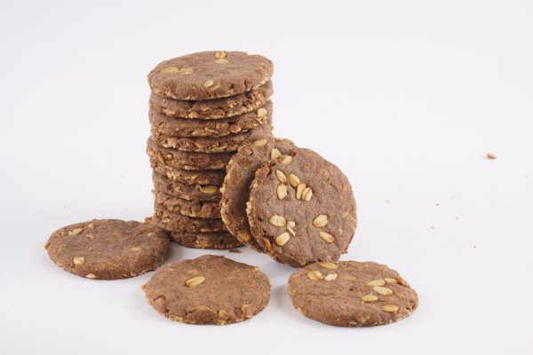 A-white-background-features-a-stack-of-cookies-made-from-ragi-oats-highlighting-their-wholesome-appearance