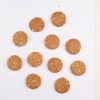 A-white-table-displays-a-bowl-of-cookies-alongside-a-bag-of-honey-oats