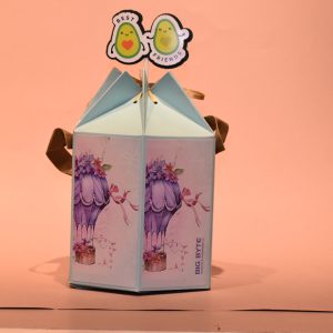 A-small-hot-air-balloon-themed-paper-hamper-with-a-bird-perched-on-top